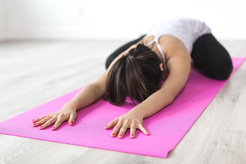 Woman practicing yoga outdoors